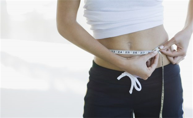 What does wearing a sports corset do for you when exercising?